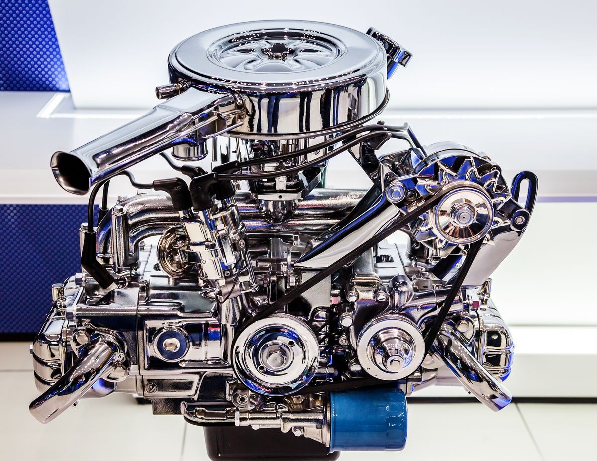 Car engine, concept of modern motor with metal, chrome, plastic parts in the mechanical engineering industry